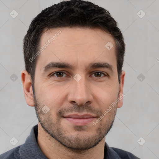 Joyful white young-adult male with short  brown hair and brown eyes