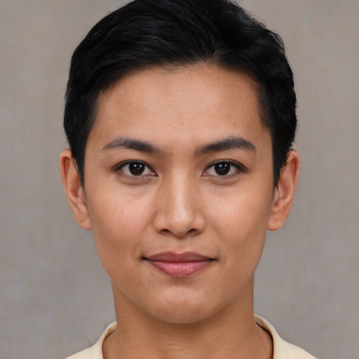 Joyful asian young-adult female with short  black hair and brown eyes