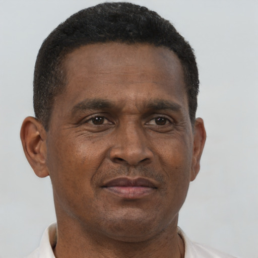 Neutral black adult male with short  brown hair and brown eyes
