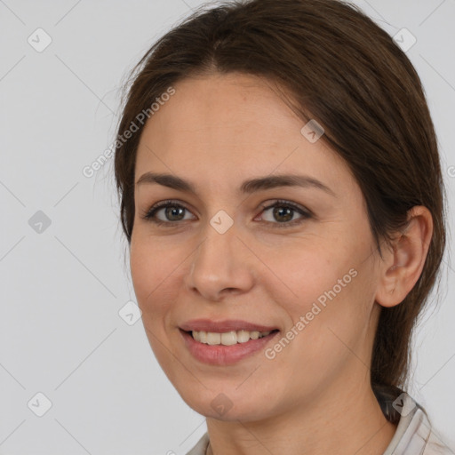 Joyful white young-adult female with medium  brown hair and brown eyes