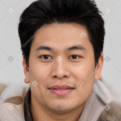 Joyful asian young-adult male with short  brown hair and brown eyes