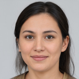 Joyful white young-adult female with medium  brown hair and brown eyes