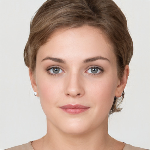 Neutral white young-adult female with medium  brown hair and grey eyes