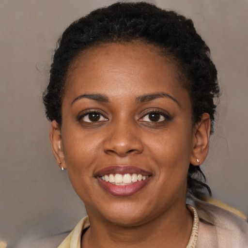 Joyful latino young-adult female with short  brown hair and brown eyes