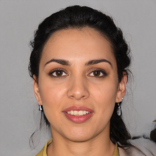 Joyful latino young-adult female with medium  black hair and brown eyes