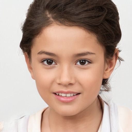 Joyful white child female with medium  brown hair and brown eyes