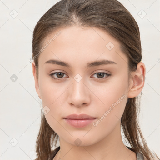 Neutral white young-adult female with long  brown hair and brown eyes