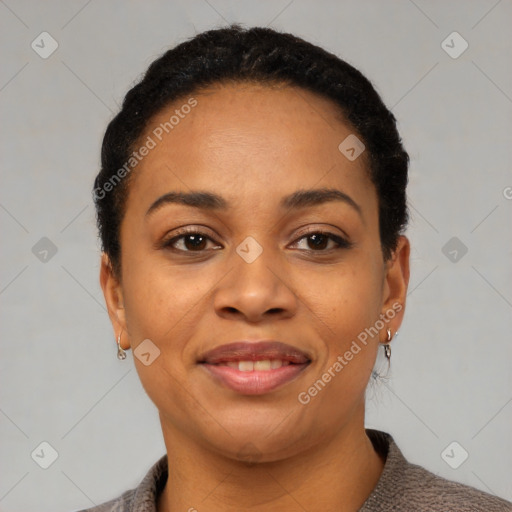 Joyful black young-adult female with short  black hair and brown eyes