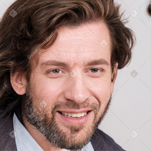 Joyful white adult male with short  brown hair and grey eyes