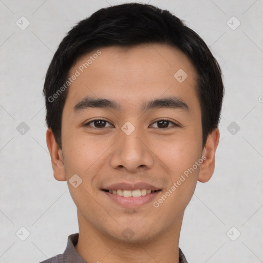 Joyful asian young-adult male with short  black hair and brown eyes