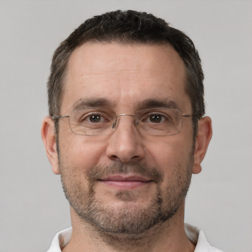 Joyful white adult male with short  brown hair and brown eyes