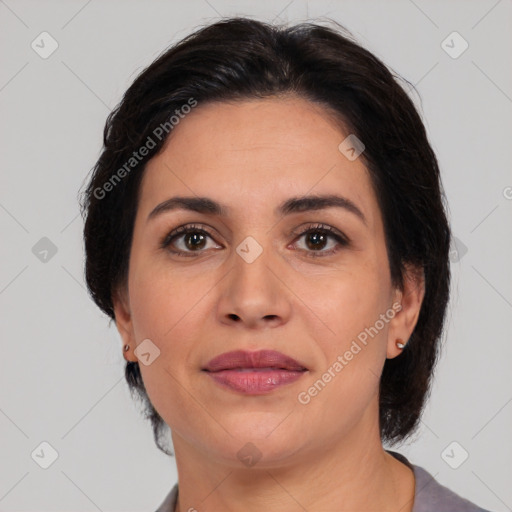 Joyful white adult female with medium  brown hair and brown eyes