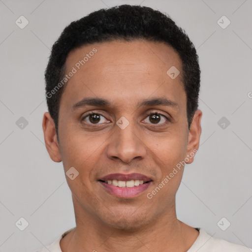 Joyful latino young-adult male with short  black hair and brown eyes