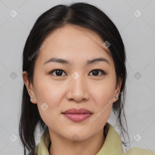 Joyful asian young-adult female with medium  brown hair and brown eyes