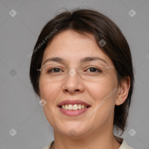 Joyful white adult female with medium  brown hair and brown eyes