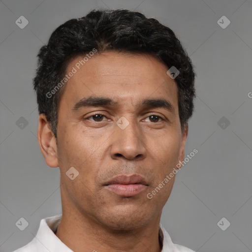 Neutral latino adult male with short  black hair and brown eyes
