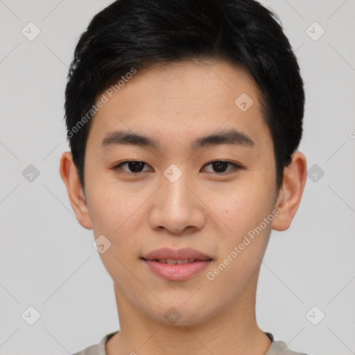 Joyful asian young-adult male with short  black hair and brown eyes