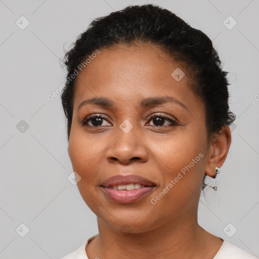 Joyful latino adult female with short  brown hair and brown eyes