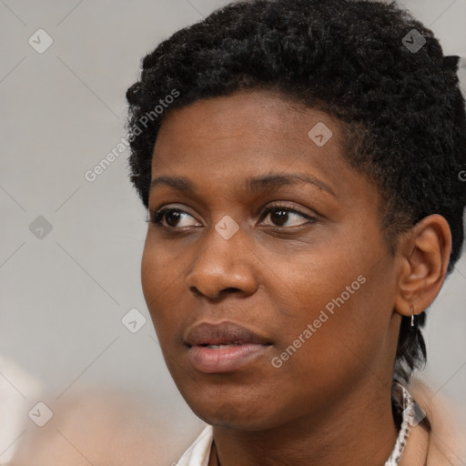 Neutral black young-adult female with short  black hair and brown eyes