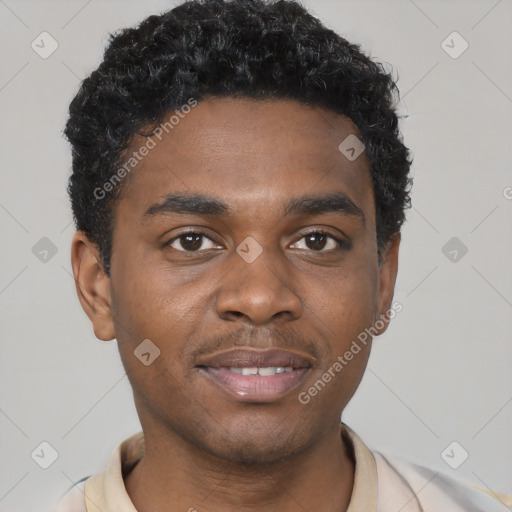 Joyful black young-adult male with short  brown hair and brown eyes