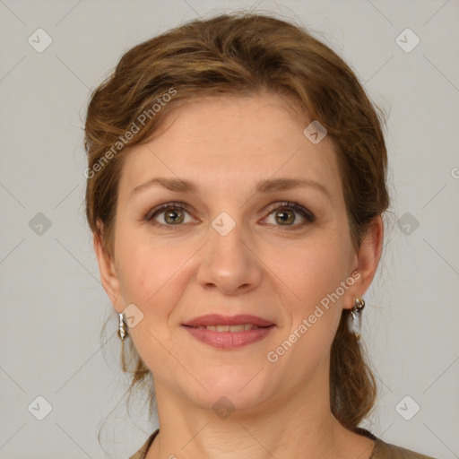 Joyful white young-adult female with medium  brown hair and green eyes