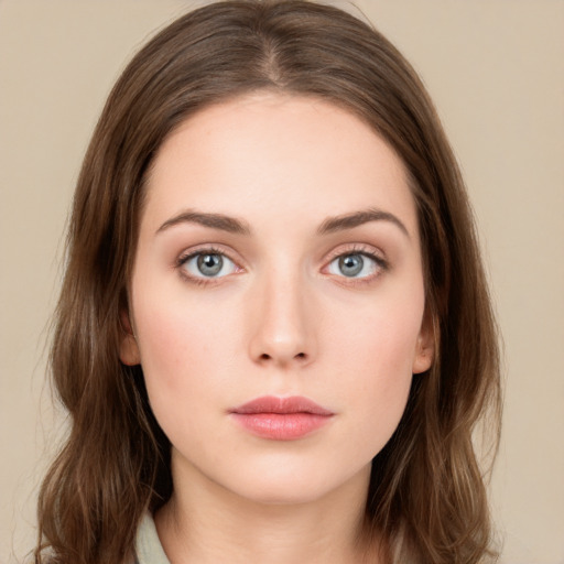 Neutral white young-adult female with long  brown hair and green eyes