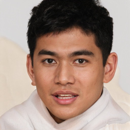 Joyful asian young-adult male with short  brown hair and brown eyes