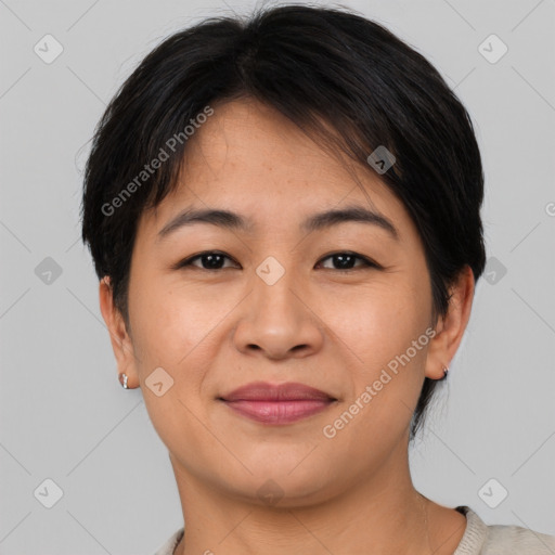 Joyful asian young-adult female with short  brown hair and brown eyes