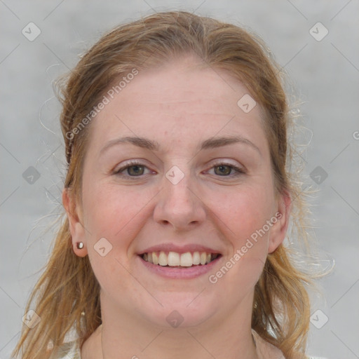 Joyful white young-adult female with medium  brown hair and blue eyes