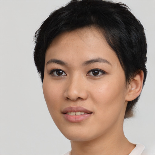 Joyful white young-adult female with short  black hair and brown eyes