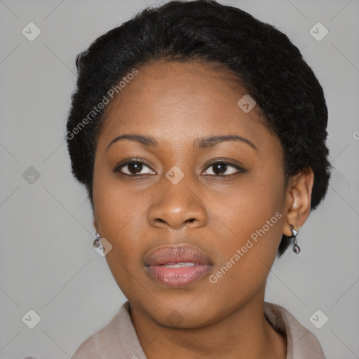 Joyful black young-adult female with short  black hair and brown eyes