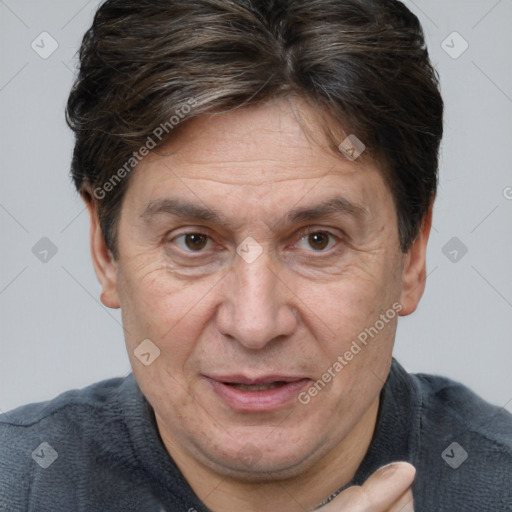 Joyful white middle-aged male with short  brown hair and brown eyes