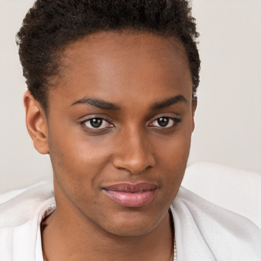 Joyful black young-adult female with short  brown hair and brown eyes