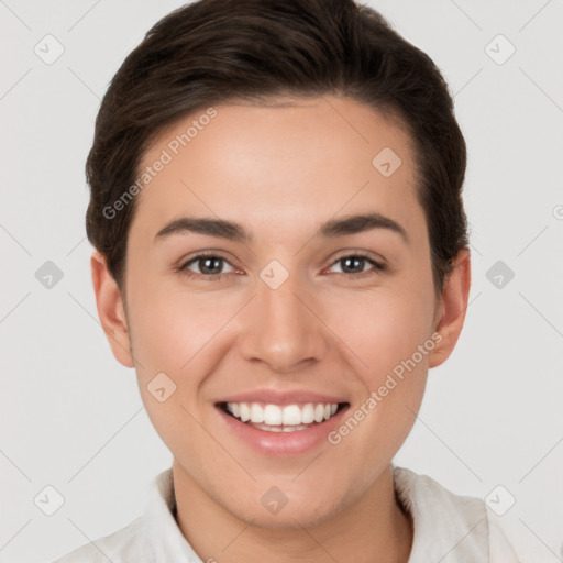 Joyful white young-adult female with short  brown hair and brown eyes