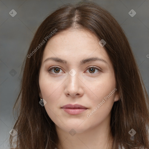 Neutral white young-adult female with long  brown hair and brown eyes