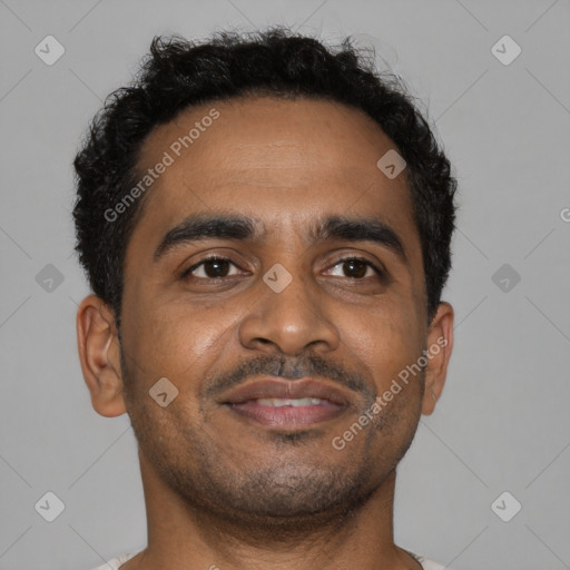 Joyful black young-adult male with short  brown hair and brown eyes