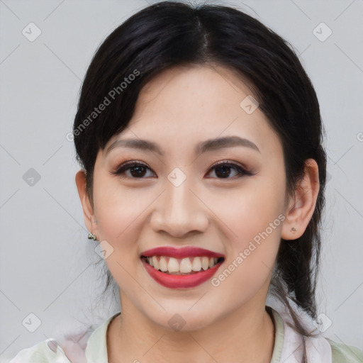 Joyful asian young-adult female with medium  black hair and brown eyes