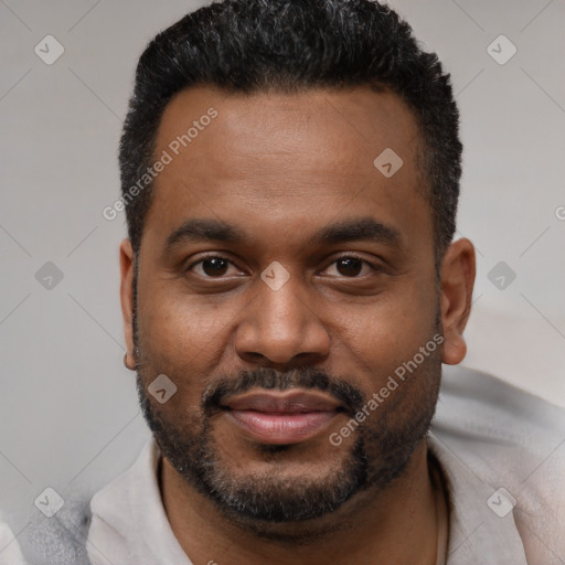 Joyful black young-adult male with short  black hair and brown eyes