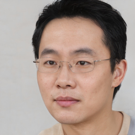 Neutral asian adult male with short  black hair and brown eyes