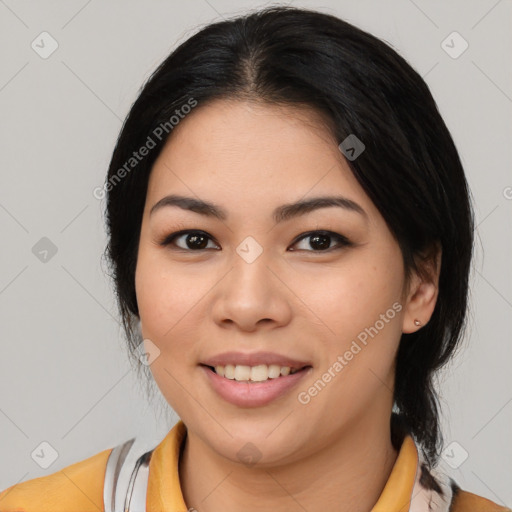 Joyful asian young-adult female with medium  black hair and brown eyes