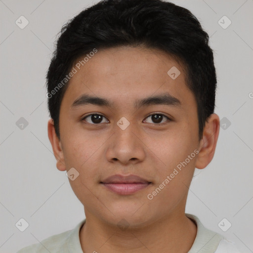 Joyful asian young-adult male with short  black hair and brown eyes