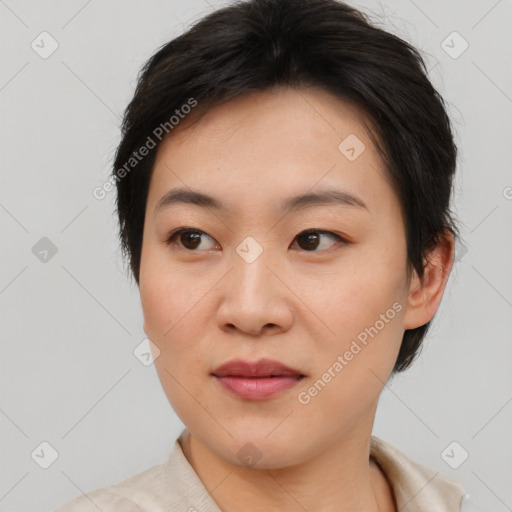 Joyful asian young-adult female with short  brown hair and brown eyes