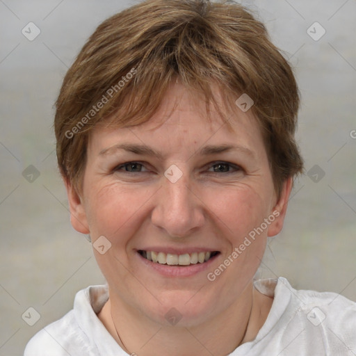 Joyful white adult female with short  brown hair and grey eyes