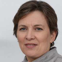 Joyful white adult female with short  brown hair and brown eyes