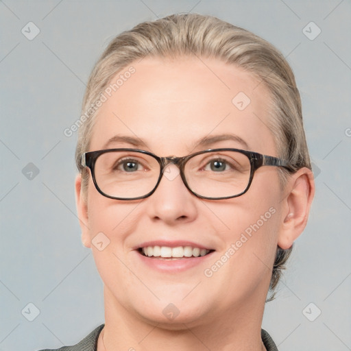 Joyful white adult female with short  brown hair and blue eyes