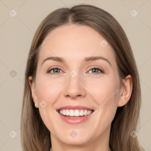 Joyful white young-adult female with long  brown hair and grey eyes