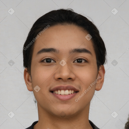 Joyful latino young-adult male with short  black hair and brown eyes