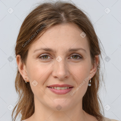 Joyful white adult female with medium  brown hair and grey eyes