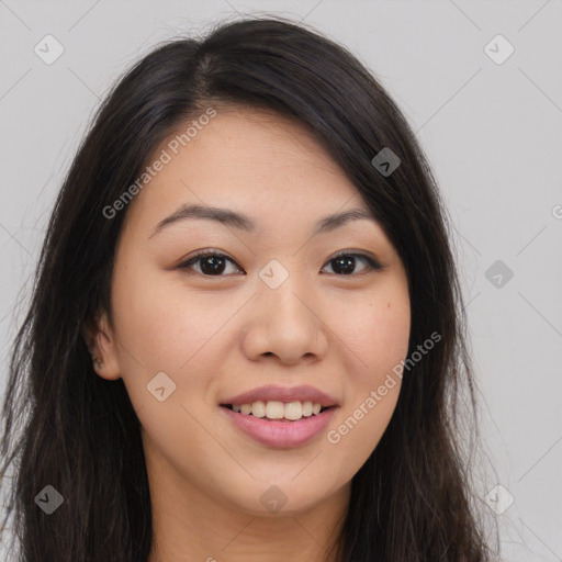 Joyful asian young-adult female with long  brown hair and brown eyes