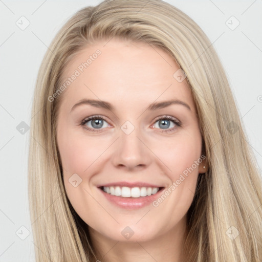 Joyful white young-adult female with long  brown hair and blue eyes